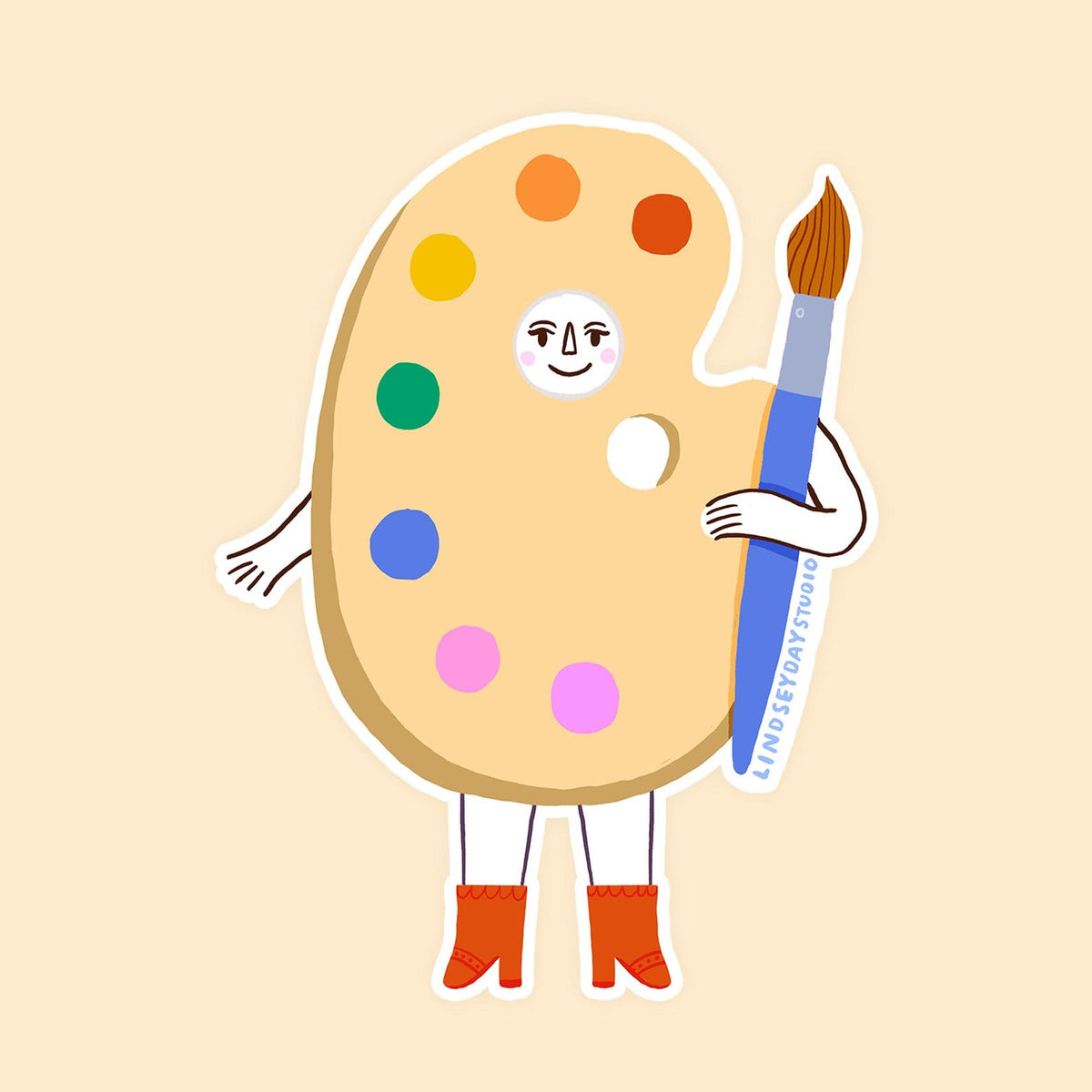 Wooden paint pallet with a rainbow of color paints. Has a face, arms and legs holding a paintbrush.