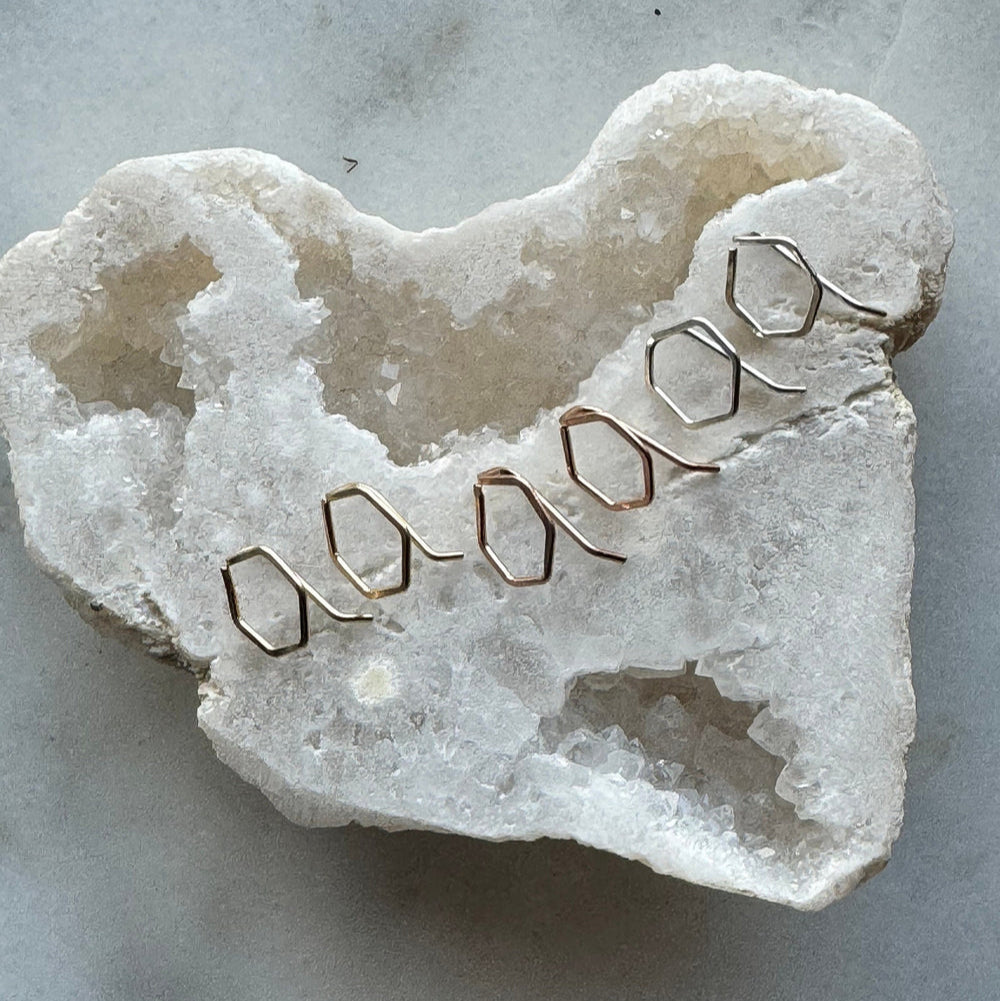 Crystal heart with gold wire heart shape on a marble surface