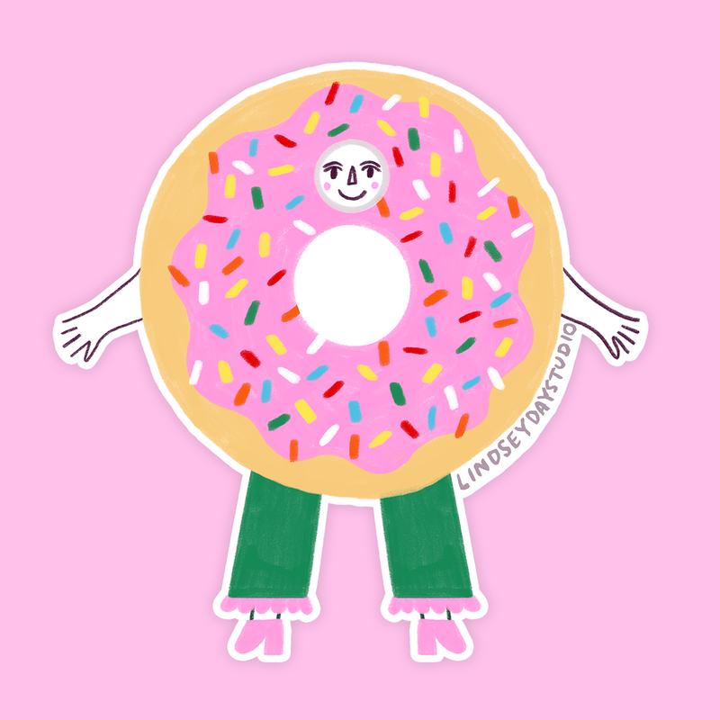 Pink frosted donut with rainbow sprinkles. Has a face, arms and legs.