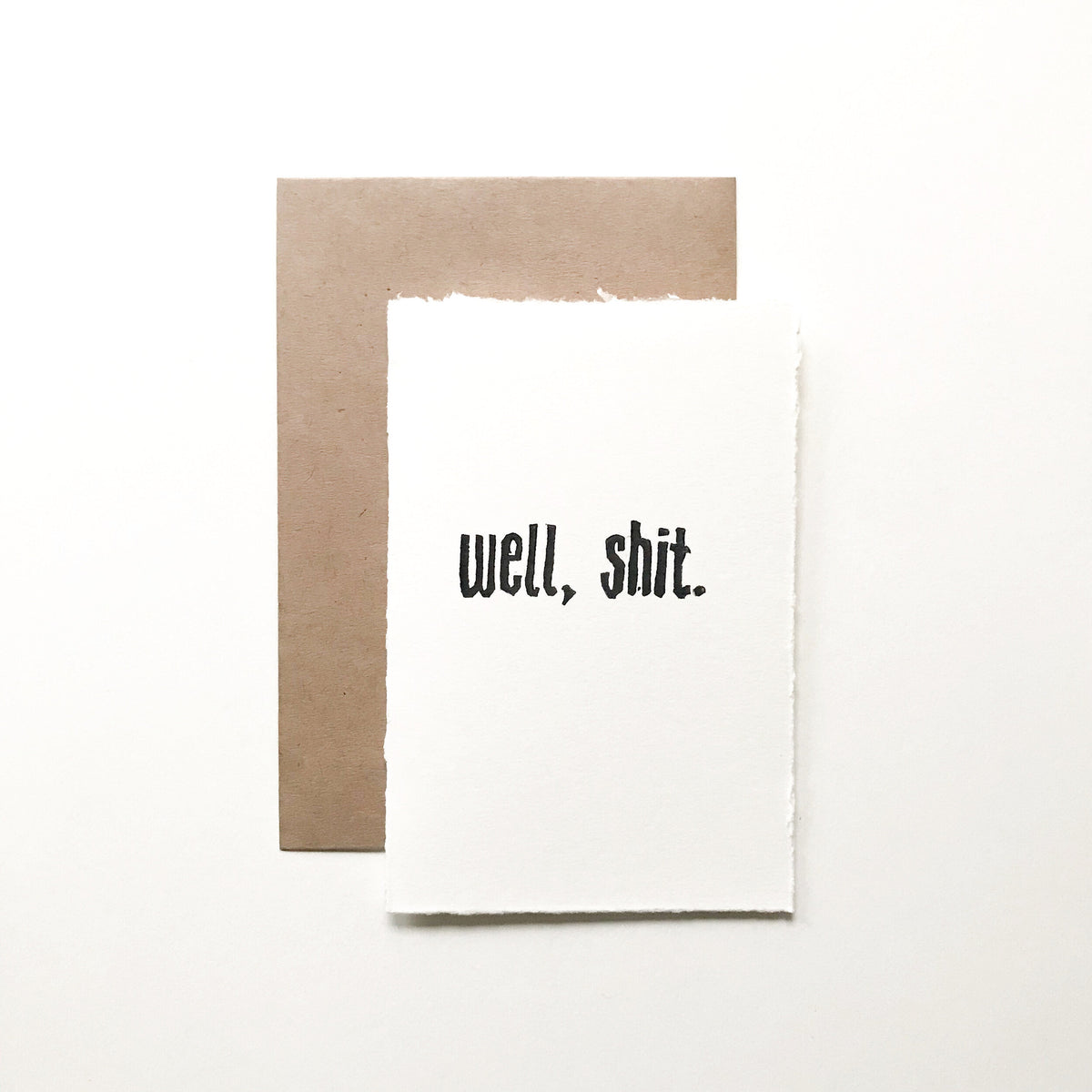 4x6 hand carved and pressed card reading "well, shit."