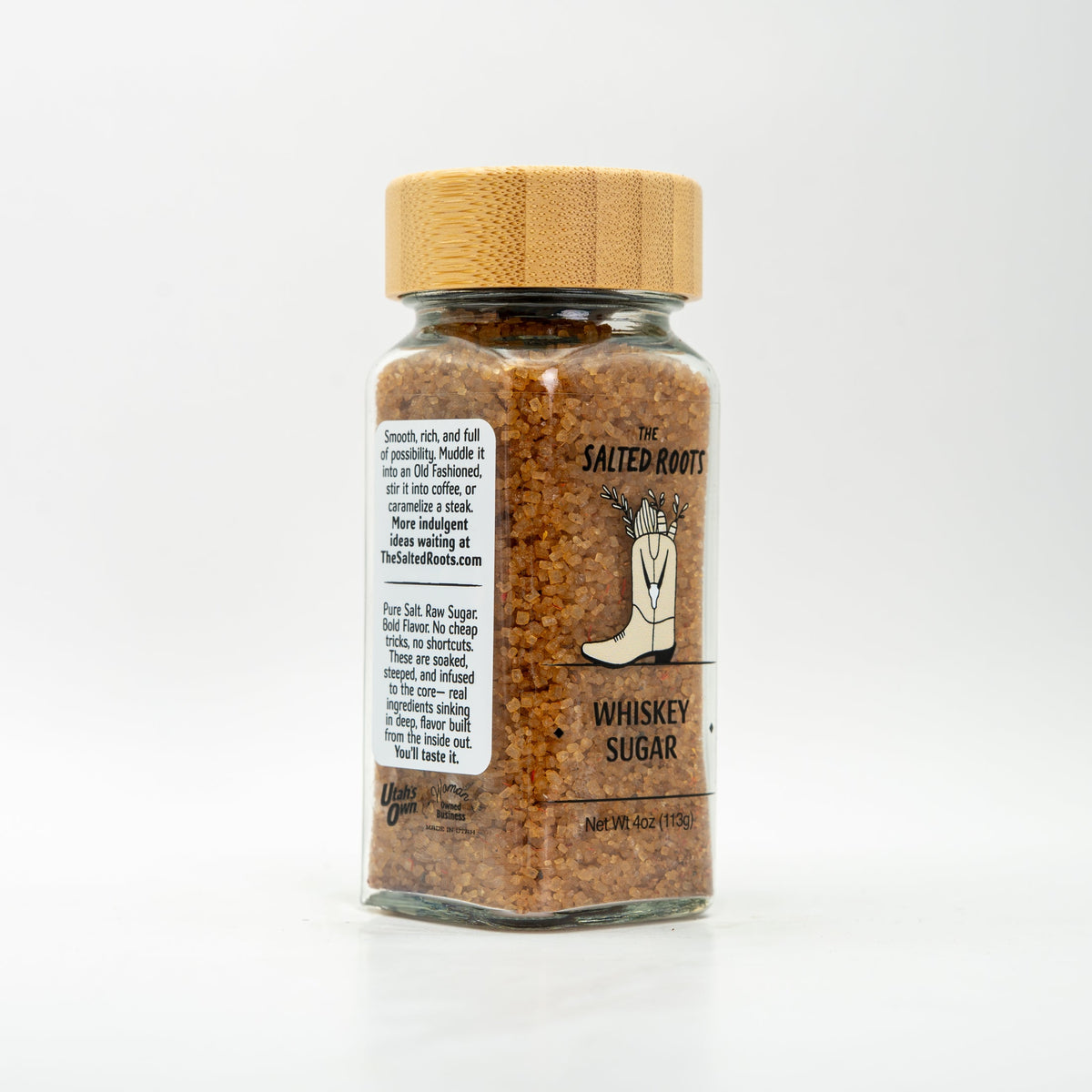 side view of glass jar with wooden lid and labels. 