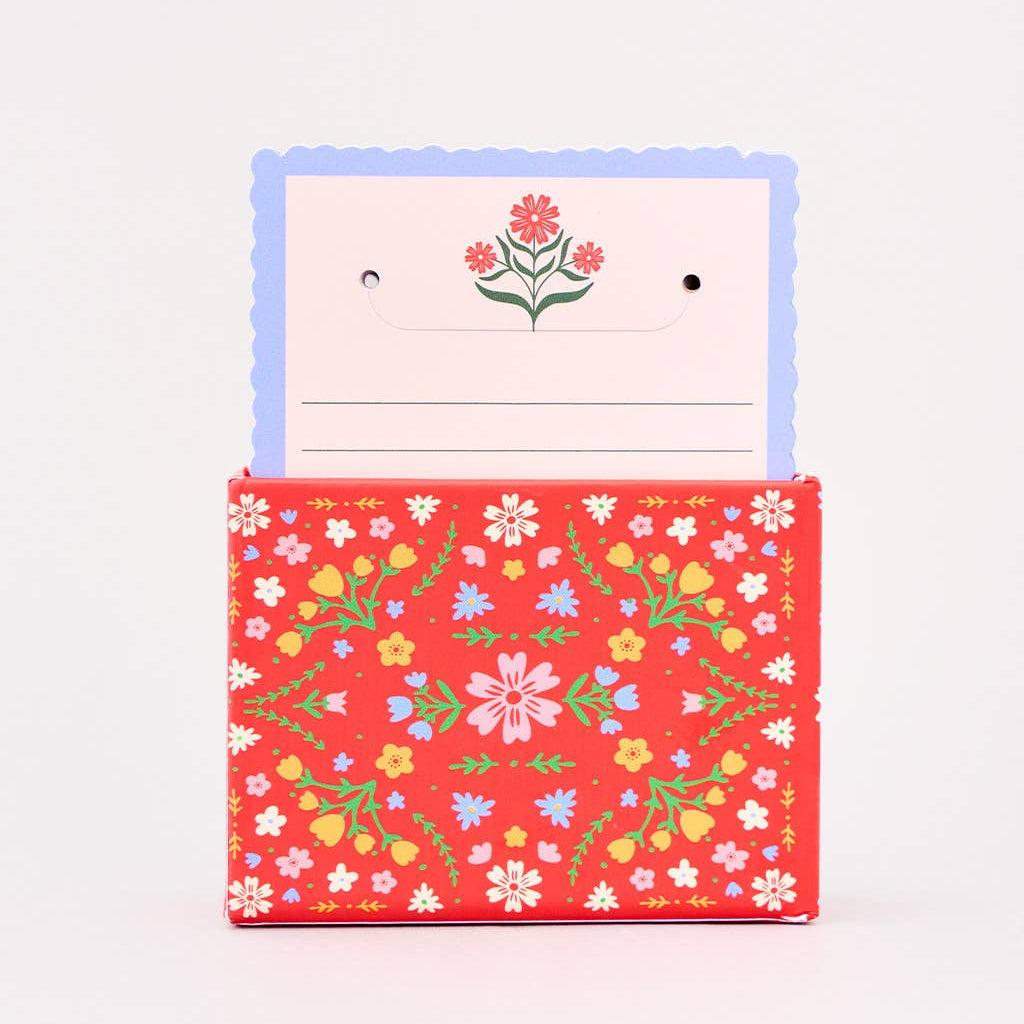 Floral notepad with a matching cover on a light gray background