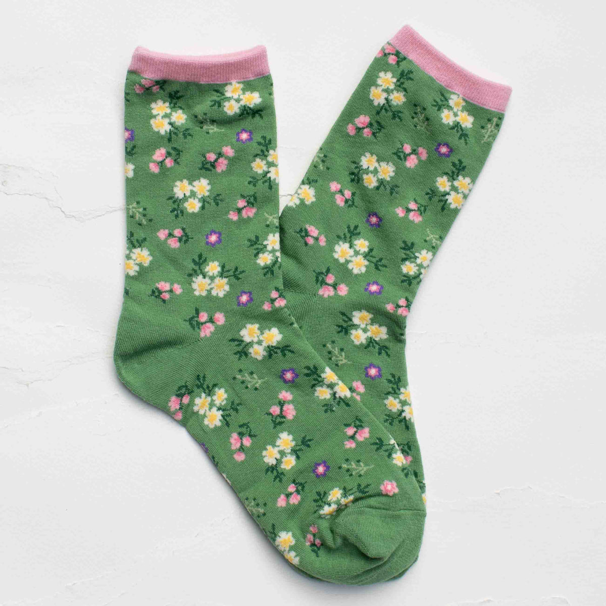 Sage Green socks with floral pattern on a white background
