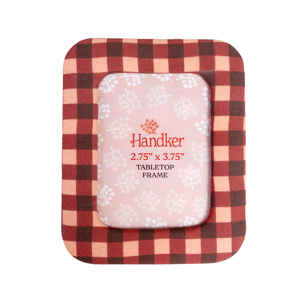 A square tabletop picture frame with a red and beige gingham border and a pale pink center insert printed with snowflakes and the Handker brand name.
