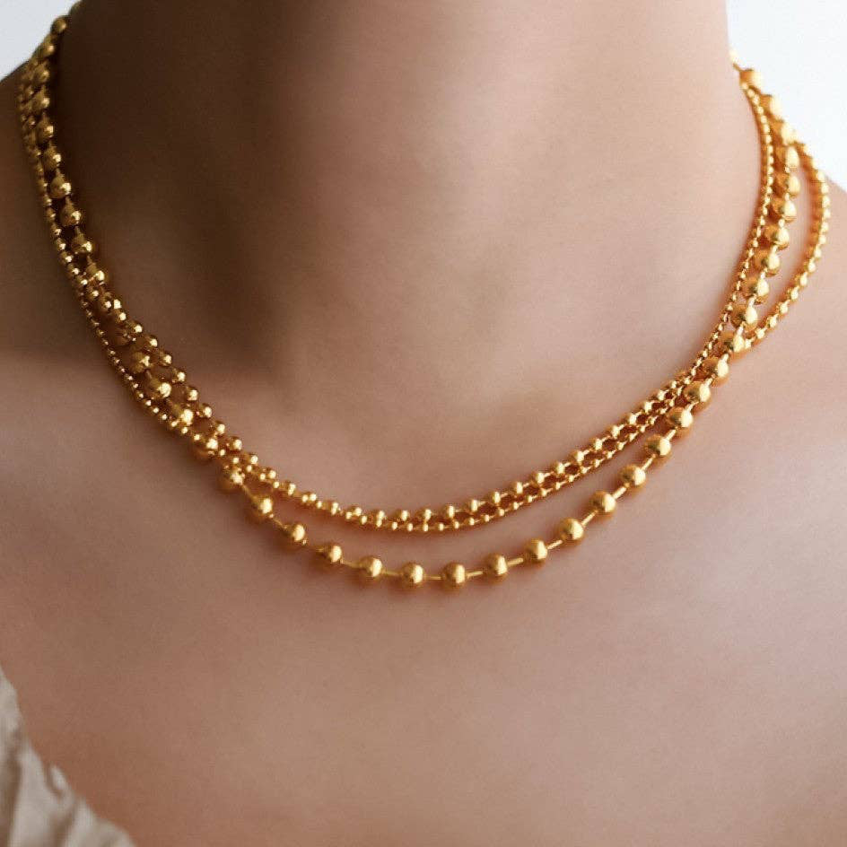 Elevate your everyday style with this stunning 18K gold plated layered chain necklace. Crafted from hypoallergenic stainless steel, it features multiple delicate strands with the shortest layer measuring 16 inches plus an adjustable extender for a customized fit. Built to withstand daily wear, this necklace resists water, fading, and tarnishing, maintaining its lustrous finish for years to come. Perfect for layering or wearing solo, it's the versatile piece every jewelry collection needs.