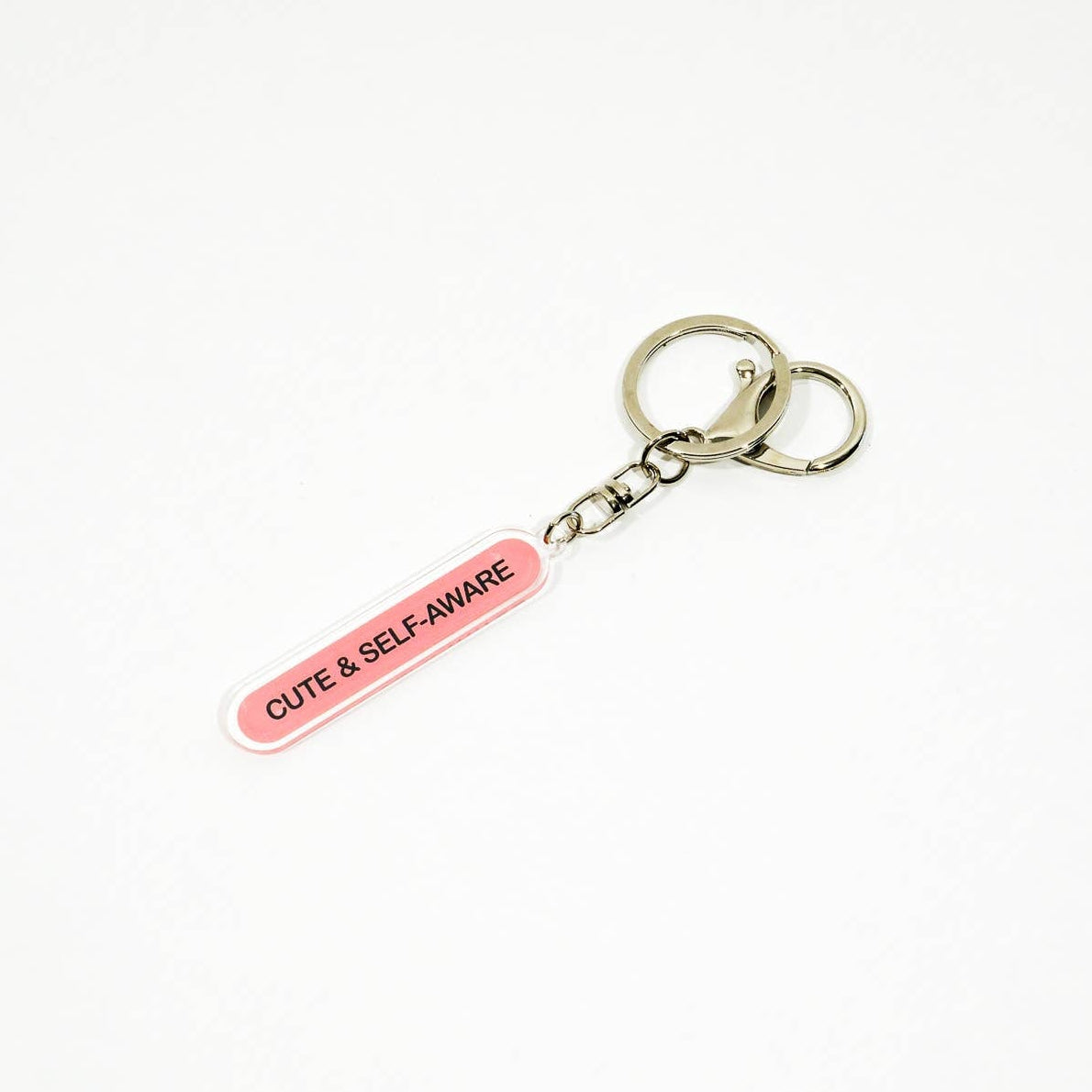 Keychain with 'Cute & Self Aware' tag on a white background