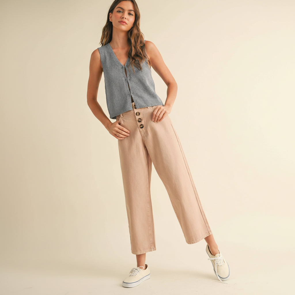 Classic cotton pants with a refined button front detail. Crafted from soft, breathable cotton for everyday comfort and versatility. The tailored fit flatters while allowing ease of movement, making these pants perfect for casual outings or dressed-up occasions. Available in a sophisticated mauve tone that pairs effortlessly with any wardrobe staple.