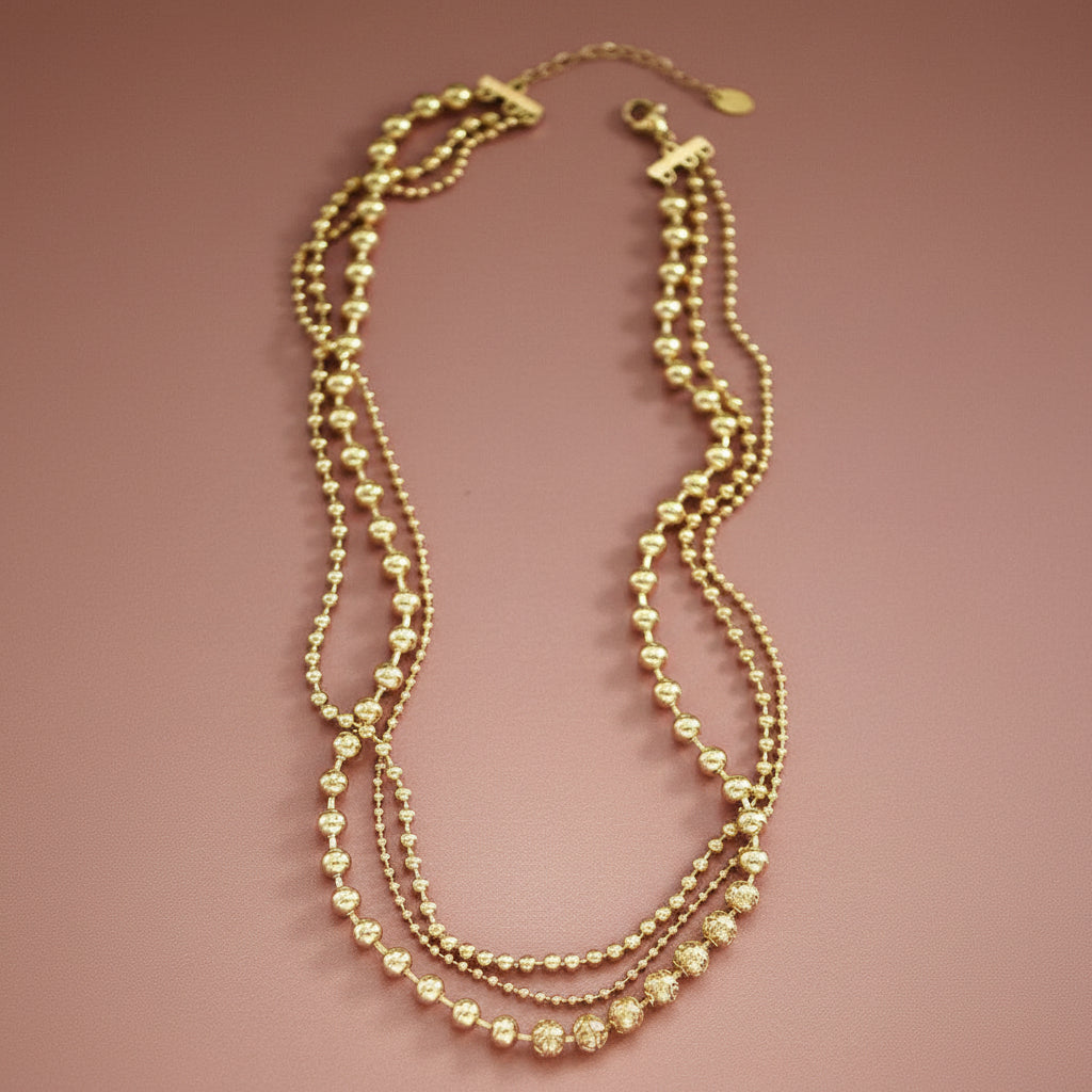 Elevate your everyday style with this stunning 18K gold plated layered chain necklace. Crafted from hypoallergenic stainless steel, it features multiple delicate strands with the shortest layer measuring 16 inches plus an adjustable extender for a customized fit. Built to withstand daily wear, this necklace resists water, fading, and tarnishing, maintaining its lustrous finish for years to come. Perfect for layering or wearing solo, it's the versatile piece every jewelry collection needs.