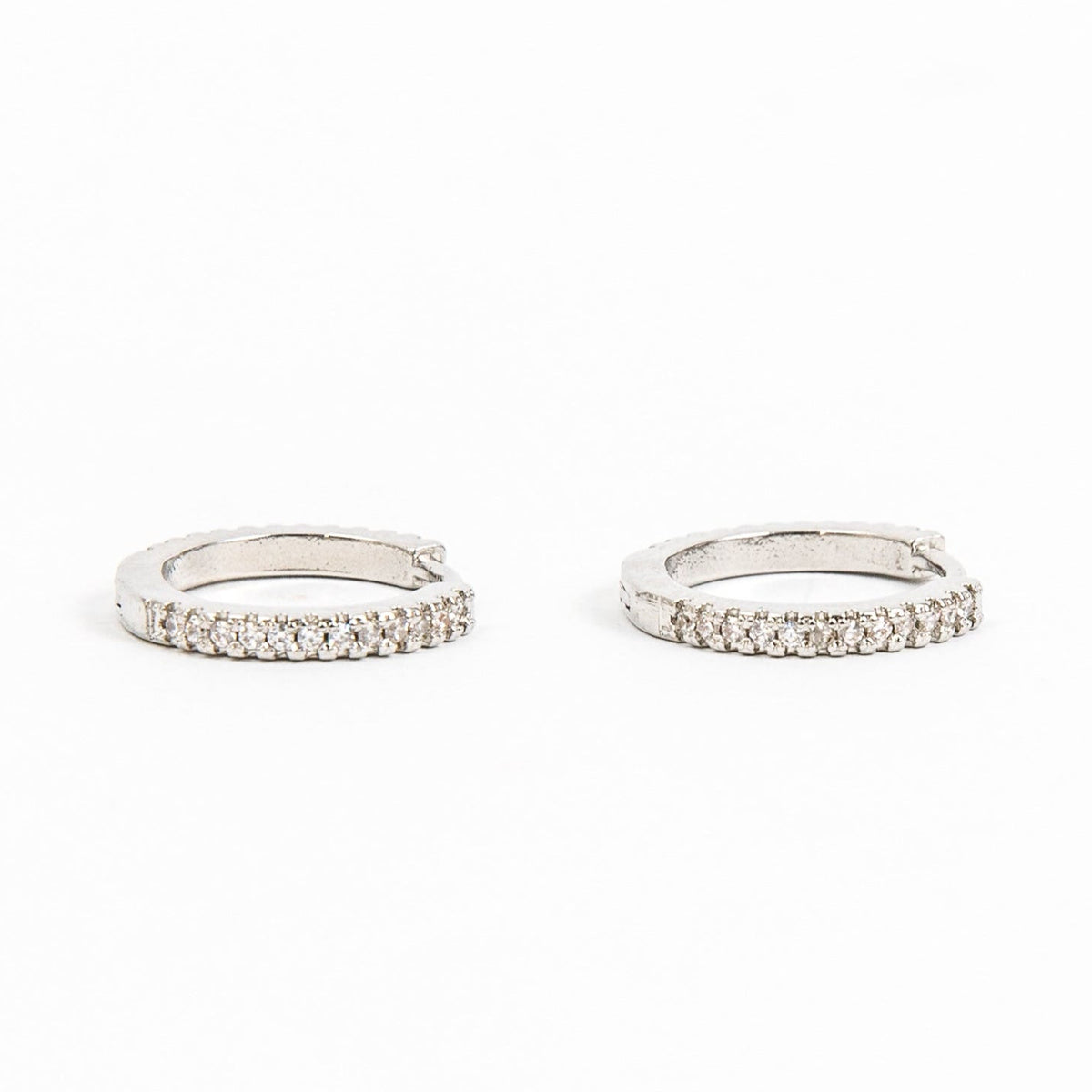 silver huggie with inset diamonds. 