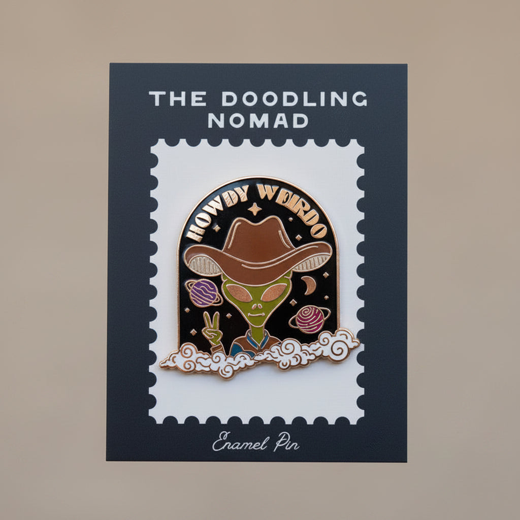 Enamel pin with black background and a alien wearing a cowboy hat and words that say "Howdy Weirdo" in gold.
