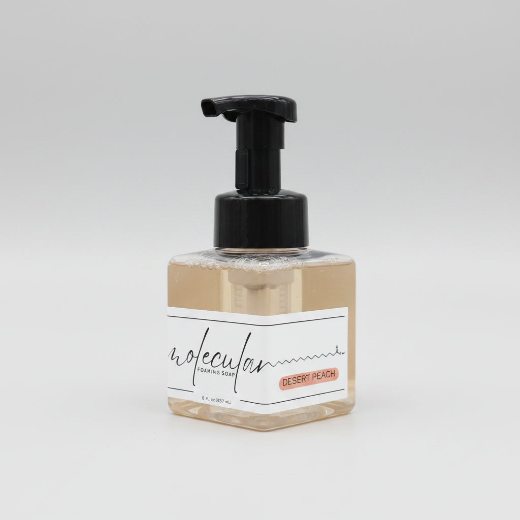 Square plastic bottle with black pump and minimalist white label. 