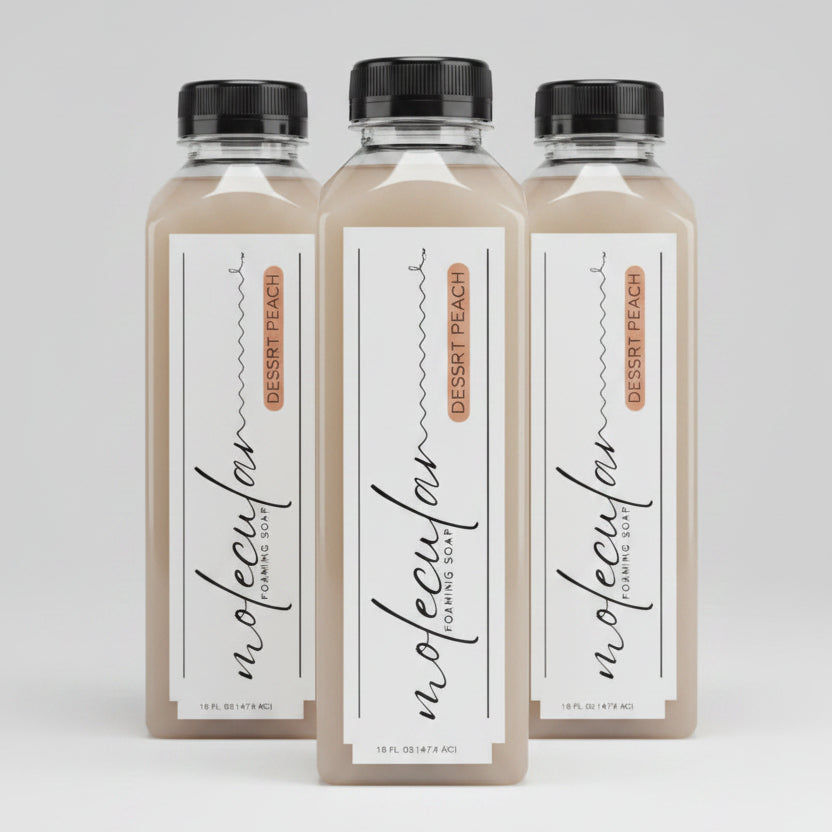 Tall clear rectangle plastic bottle with black lid and white minimalistic label. 