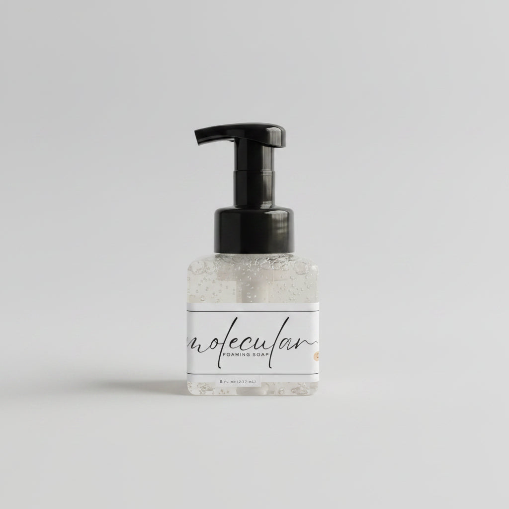 Square plastic bottle with black pump and white minimalistic label. 