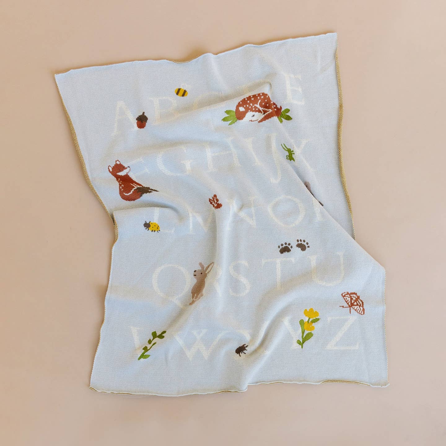 Wander through the woods and learn the alphabet with Rusty Fox. Share his love of nature and reading with this 100% GOTS certified organic cotton blanket, ensuring the softest and safest embrace for your baby's delicate skin. Wrap your precious bundle in comfort and style with this eco-friendly, irresistibly cute baby blanket that promises both warmth and peace of mind. Pair with Rusty Fox Plush Toy and Rattle.

Details:

Designed in Salt Lake City
Embroidered details
Measures 32 x 40 in
100% Organic Cotton