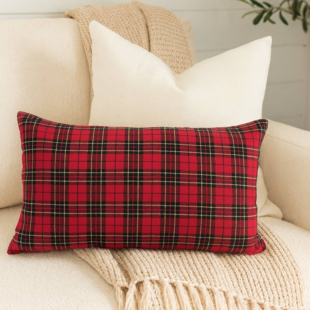 Bring a touch of traditional, festive charm and cozy comfort to your space with the Tartan Plaid Throw Pillow. A black and red tartan pattern gives this rectangle throw pillow a touch of timeless charm that'll spruce up your holiday setting in classic style. Soft yet durable for everyday use, layer this bedding with all-white linens for a classic look or with iconic holiday prints for a playful ensemble.

Details:

Approx. 12" W x 20" L
Colors/finish: Red
Machine wash cold