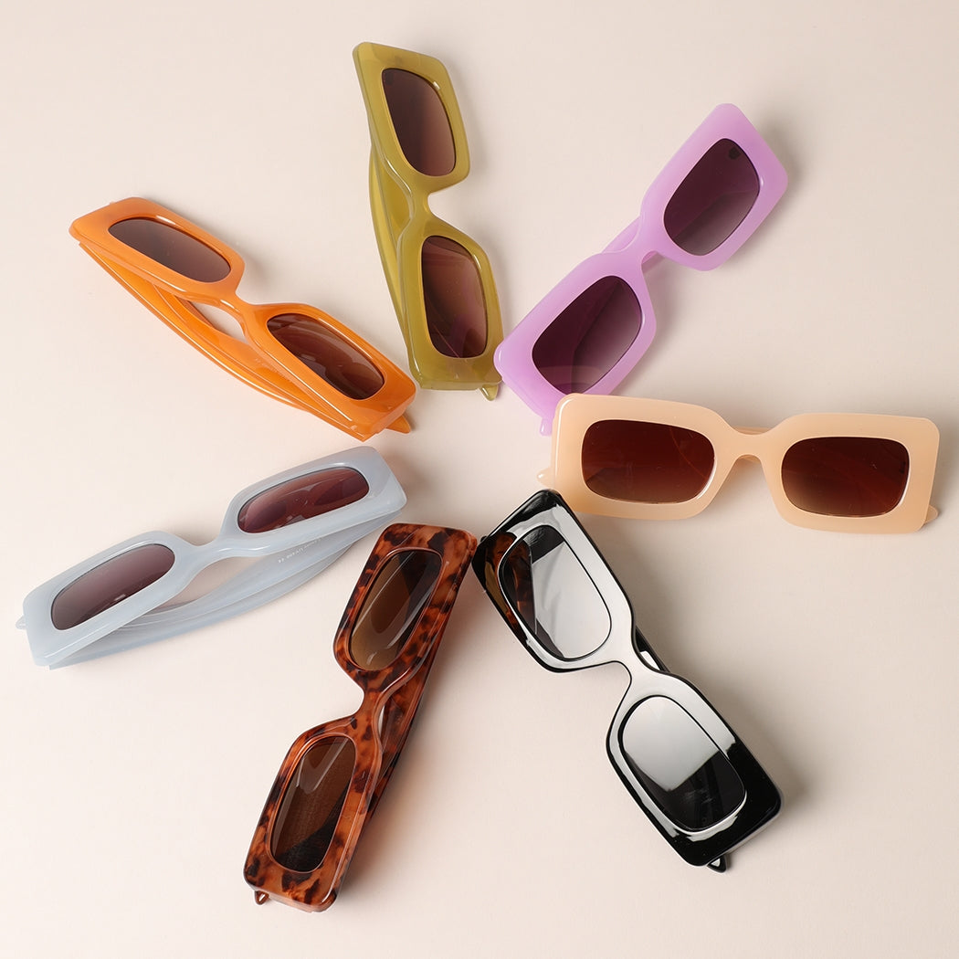 Make a statement with these bold rectangular sunglasses designed for confident style. Available in 7 stunning colors, each pair features a striking geometric frame that flatters and protects. Whether you're drawn to classic neutrals or vibrant hues, there's a shade to match your mood and personality. UV protection keeps your eyes safe while you shine. Find your perfect color and wear it with pride.