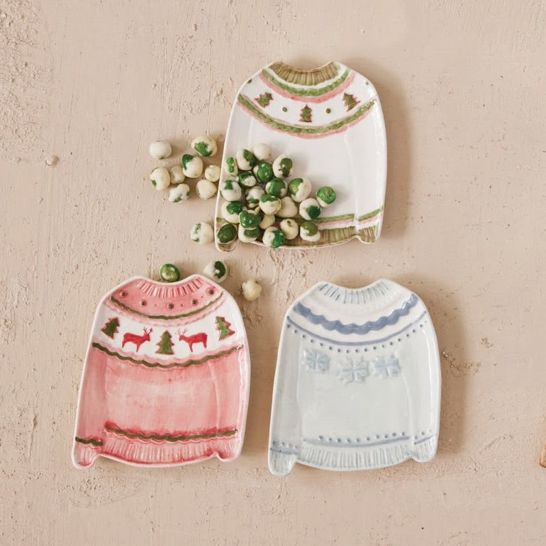 Festive stoneware plate shaped like a cozy Christmas sweater—a whimsical addition to holiday table settings. Perfect for serving appetizers, treats, or displaying seasonal décor. Available in 3 charming styles to match your holiday aesthetic.