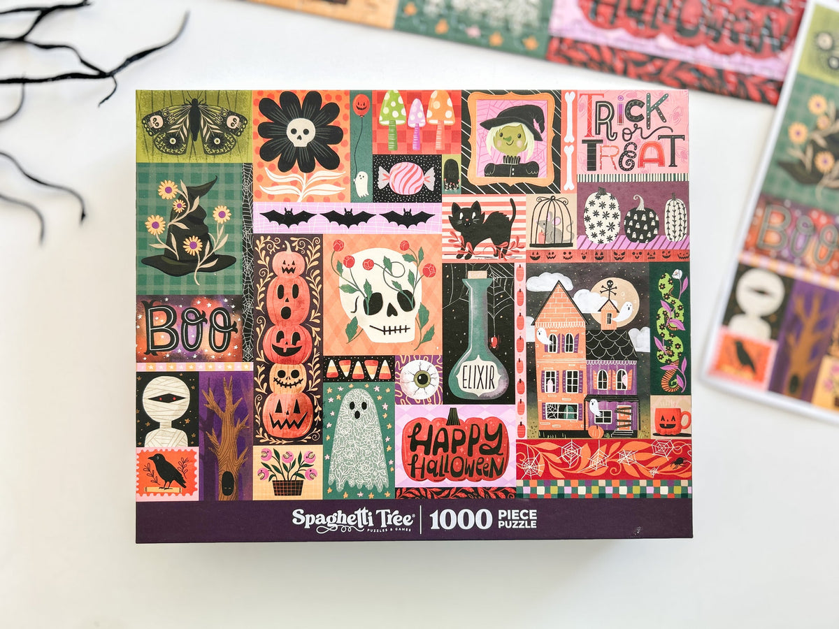 Above view of halloween puzzle. Patchwork style graphics of spooky halloween things like pumpkins, spiders, witches hat, ghost, ect. 