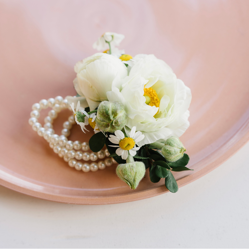 beautifully arranged floral corsages with peal bracelt