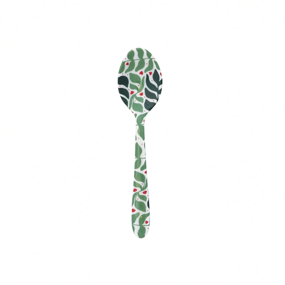 Decorative spoon with leaf pattern on a white background