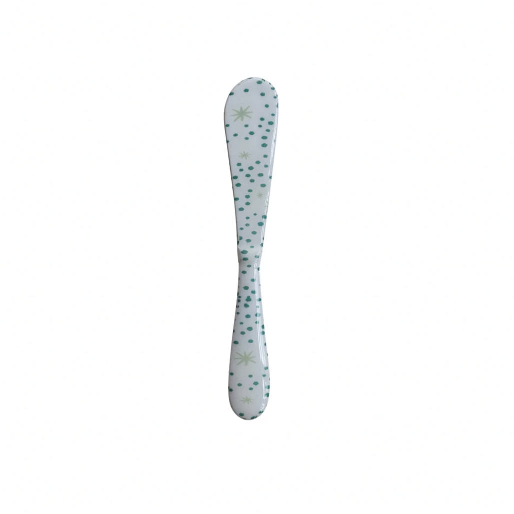 Butterfly-themed spoon on a white background