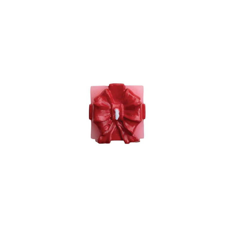 Red bow on top of candle
