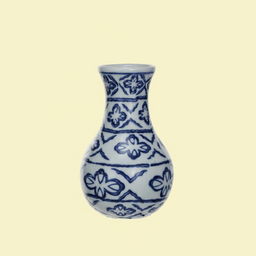 Ceramic vase with blue floral  abstract patterns on a white background