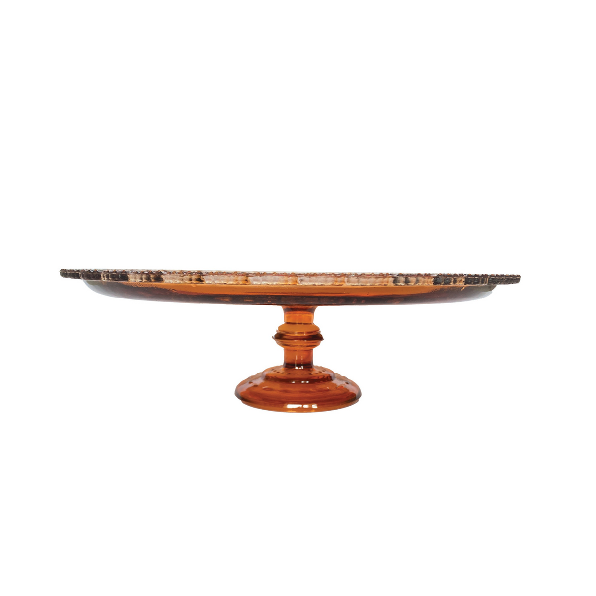 An amber glass pedestal cake stand with a scalloped rim and a round base, shown on a plain white background.