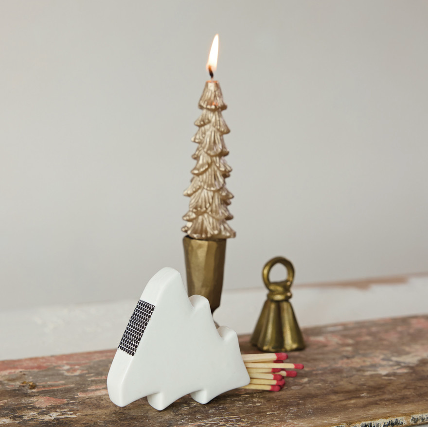 Stoneware Tree Shaped Match Holder & Striker. Add a cozy, welcoming glow to your home with our Stoneware Tree Shaped Match Holder & Striker. Crafted with care in a lovely white finish, this charming holiday accent brings warmth and convenient style right to your mantel or tabletop.
