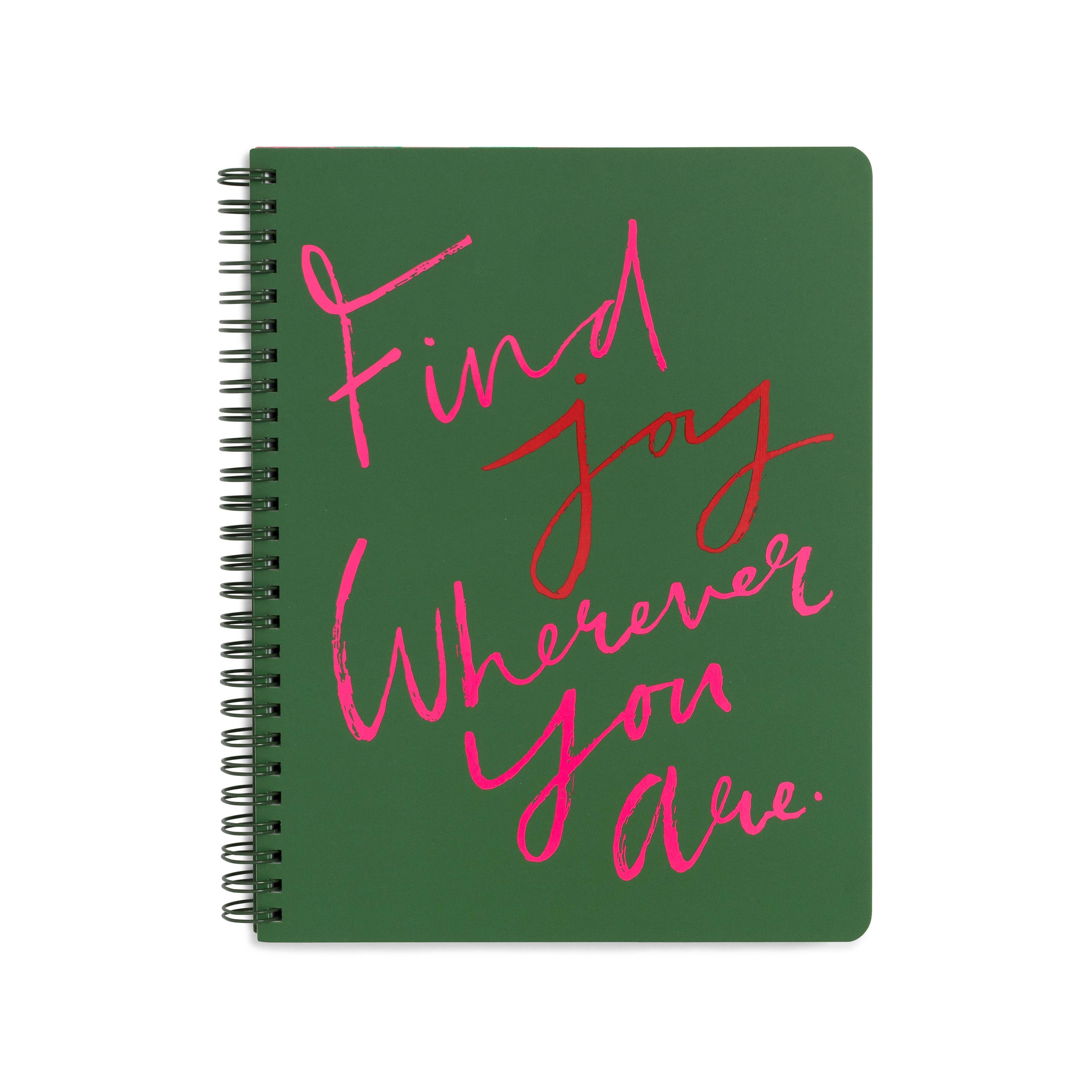 Green notebook with pink text on a white background