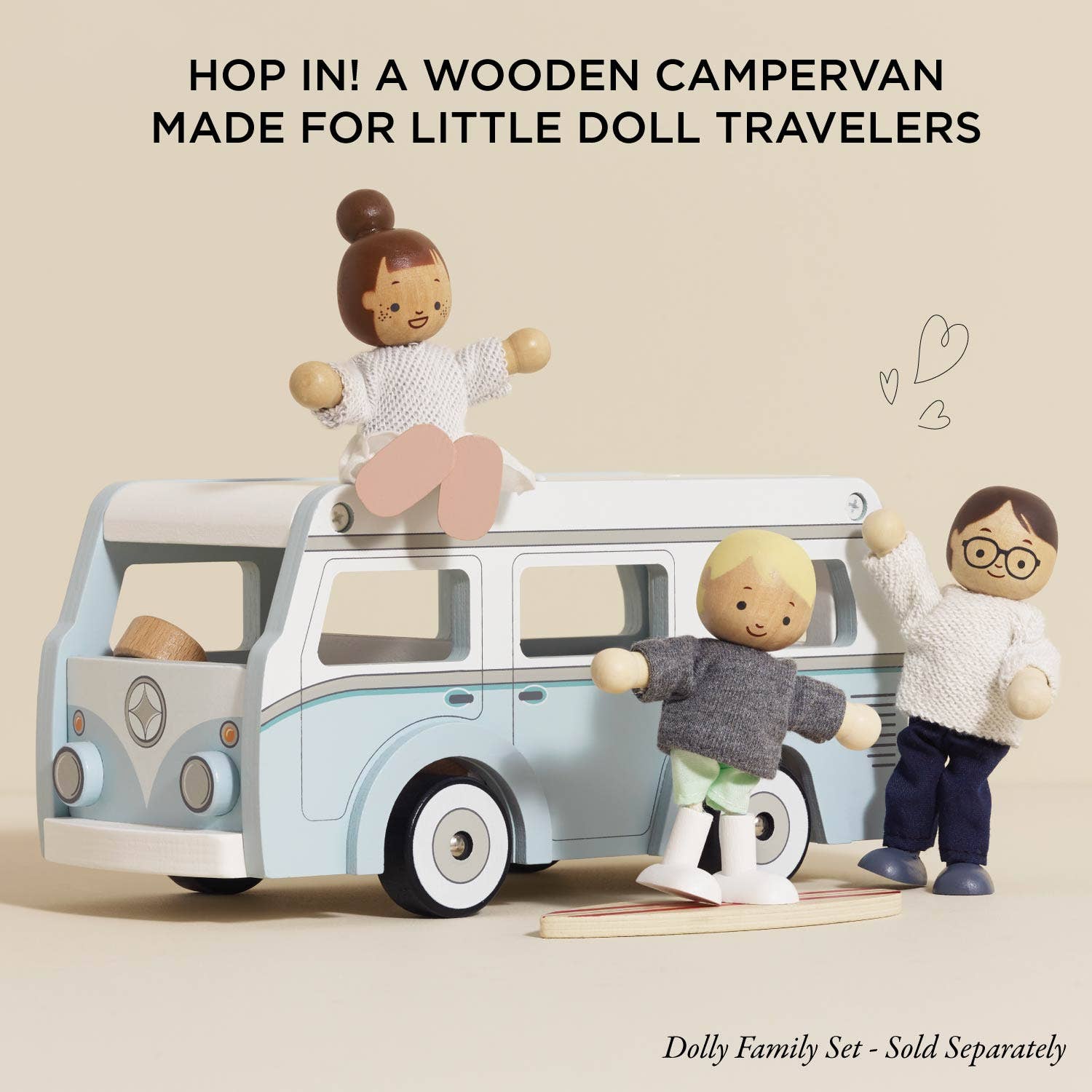 Wooden campervan with dolls on a beige background