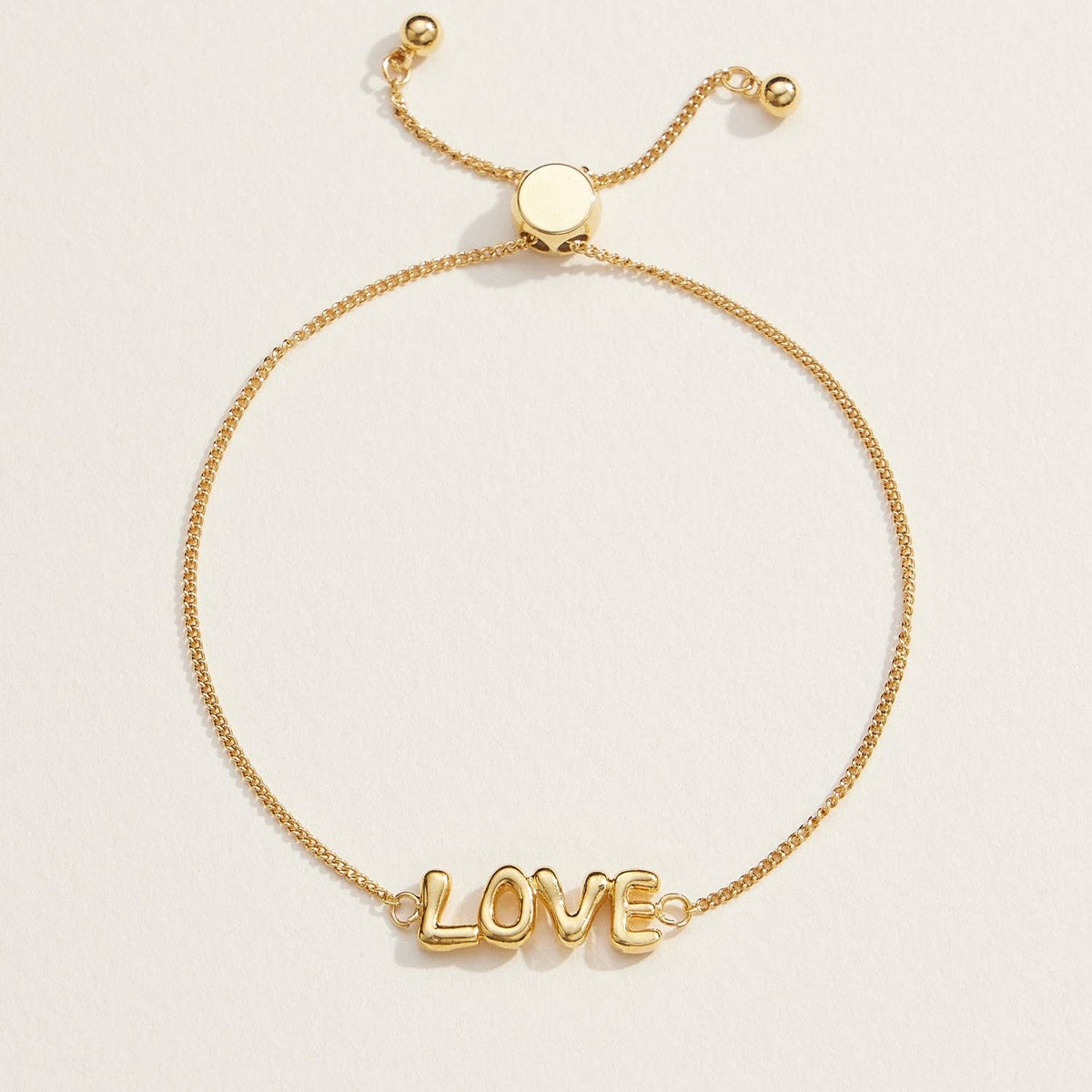 Spread love with our Love Script Adjustable Bracelet, featuring a sleek "LOVE" design in polished gold tones. This lightweight and chic bracelet has an adjustable chain with a sliding clasp, ensuring a perfect fit for any wrist size. Whether worn solo or layered, this bracelet is a versatile accessory for daily wear or special occasions. It's an ideal gift for anniversaries, Valentine's Day, or simply to show someone you care.

Details:

Love Script
Adjustable
18K Gold Dipped Bracelet in Gold