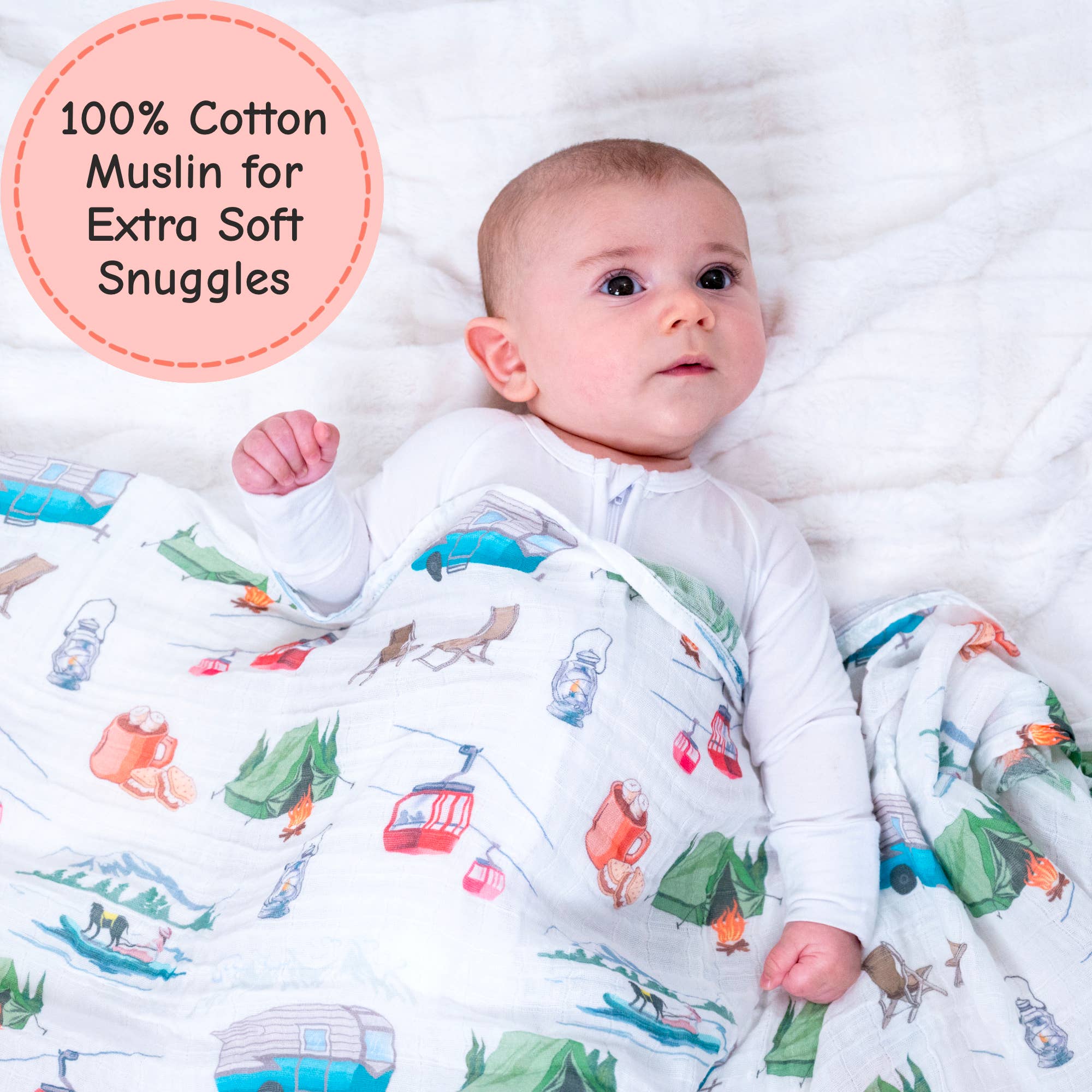 Baby wrapped in a colorful cotton muslin blanket with cartoon designs on a white background.