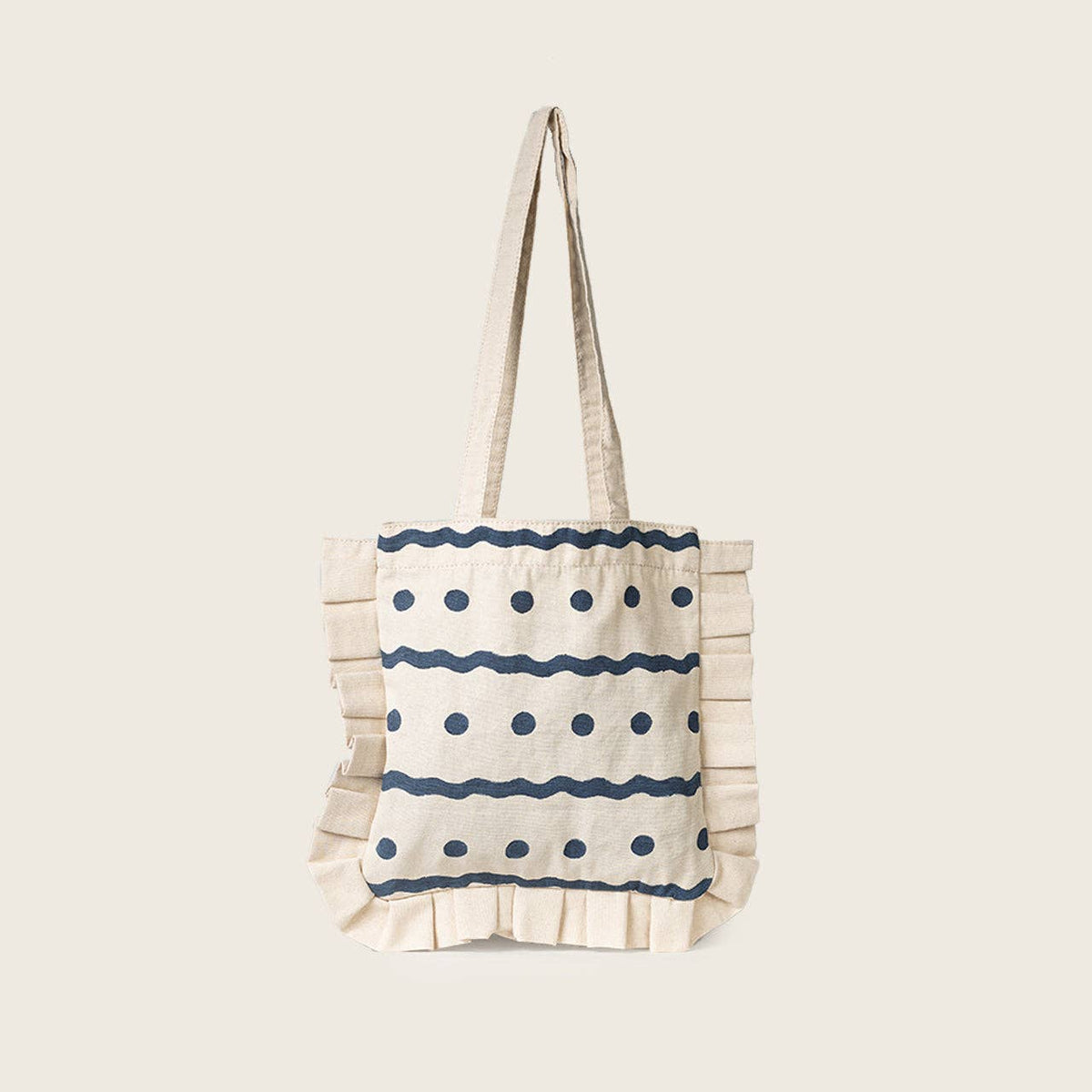 Tote bag with blue wave pattern on a beige background