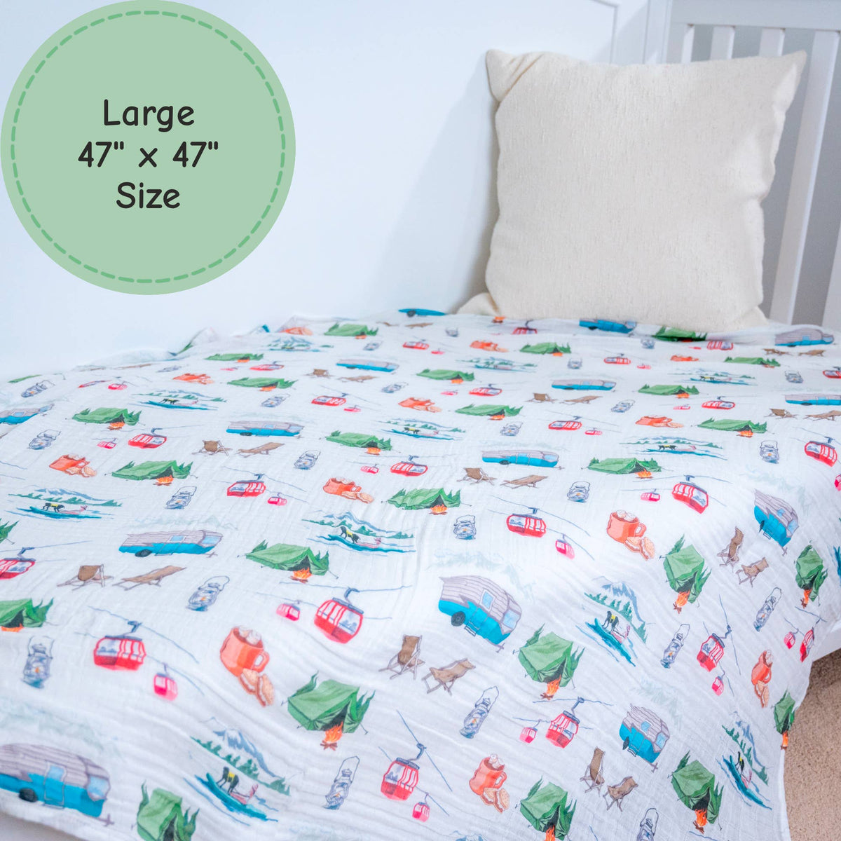 Children's bedding with vehicle pattern on a bed with a pillow.