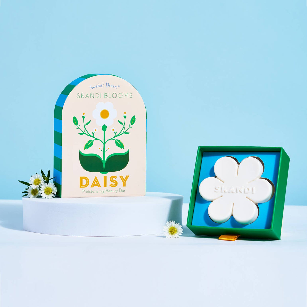 The magic of spring is finally here. Each Skandi Blooms Beauty Bar is formulated with skin-softening sunflower lecithin, helping you feel hydrated and clean. Daisies are a symbol of joy and happiness. In spring, their fresh white petals and bright yellow center invite feelings of simplicity and new beginnings as we bid farewell to winter. Breathe in the unmistakable scent of spring rain as it lays a delicate, cool mist on a bundle of happy little daisies.&nbsp;