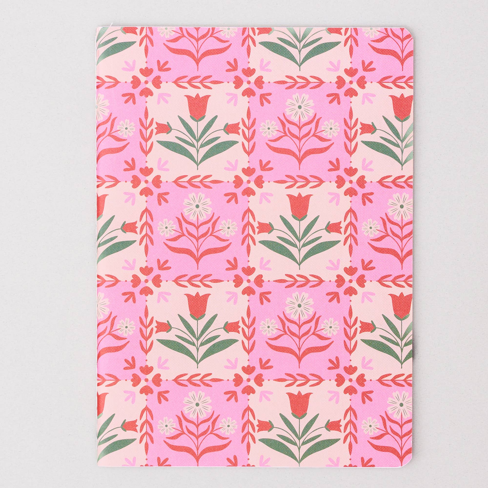 Floral patterned notebook on a light gray background