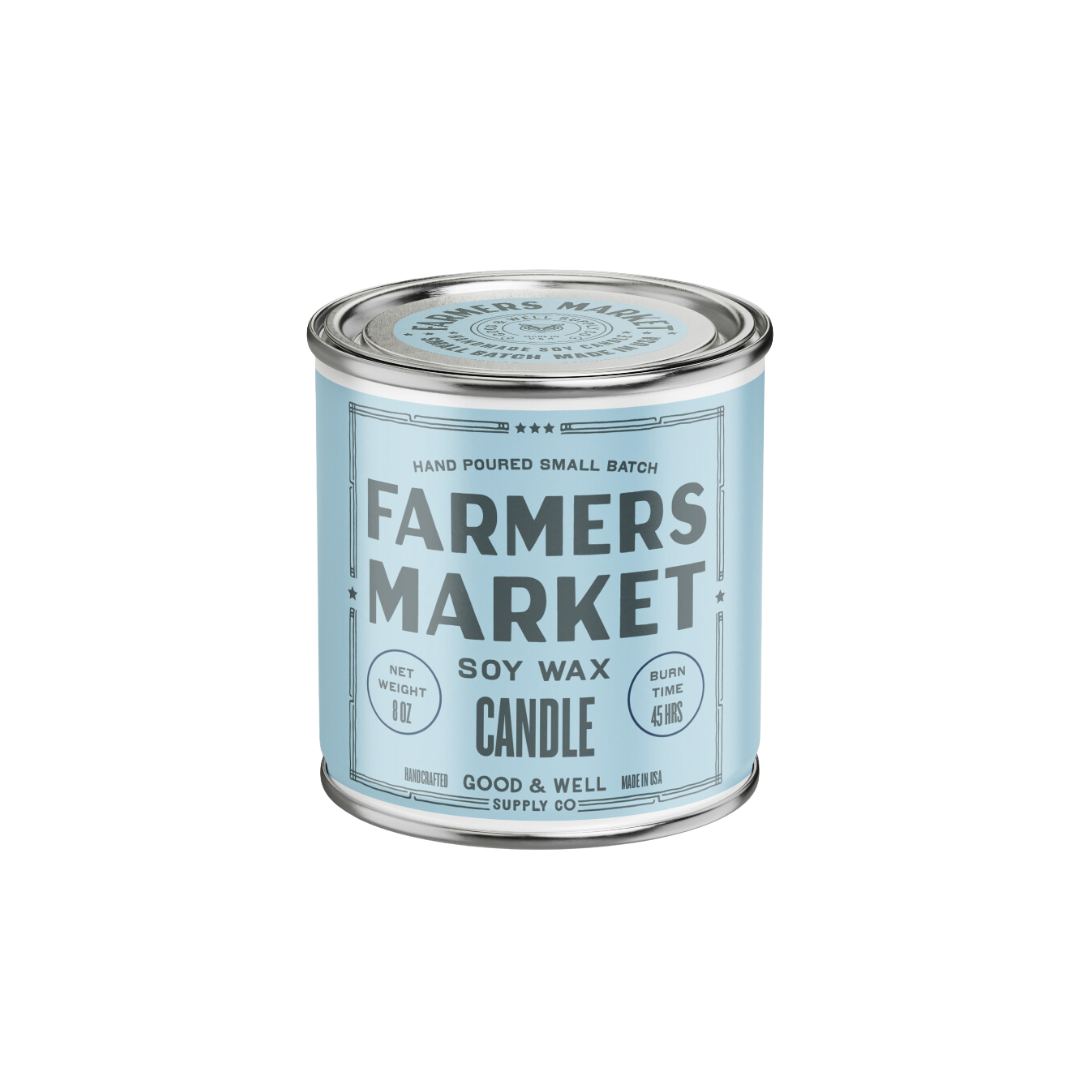 Candle container labeled 'Farmers Market' with a blue label on a white background