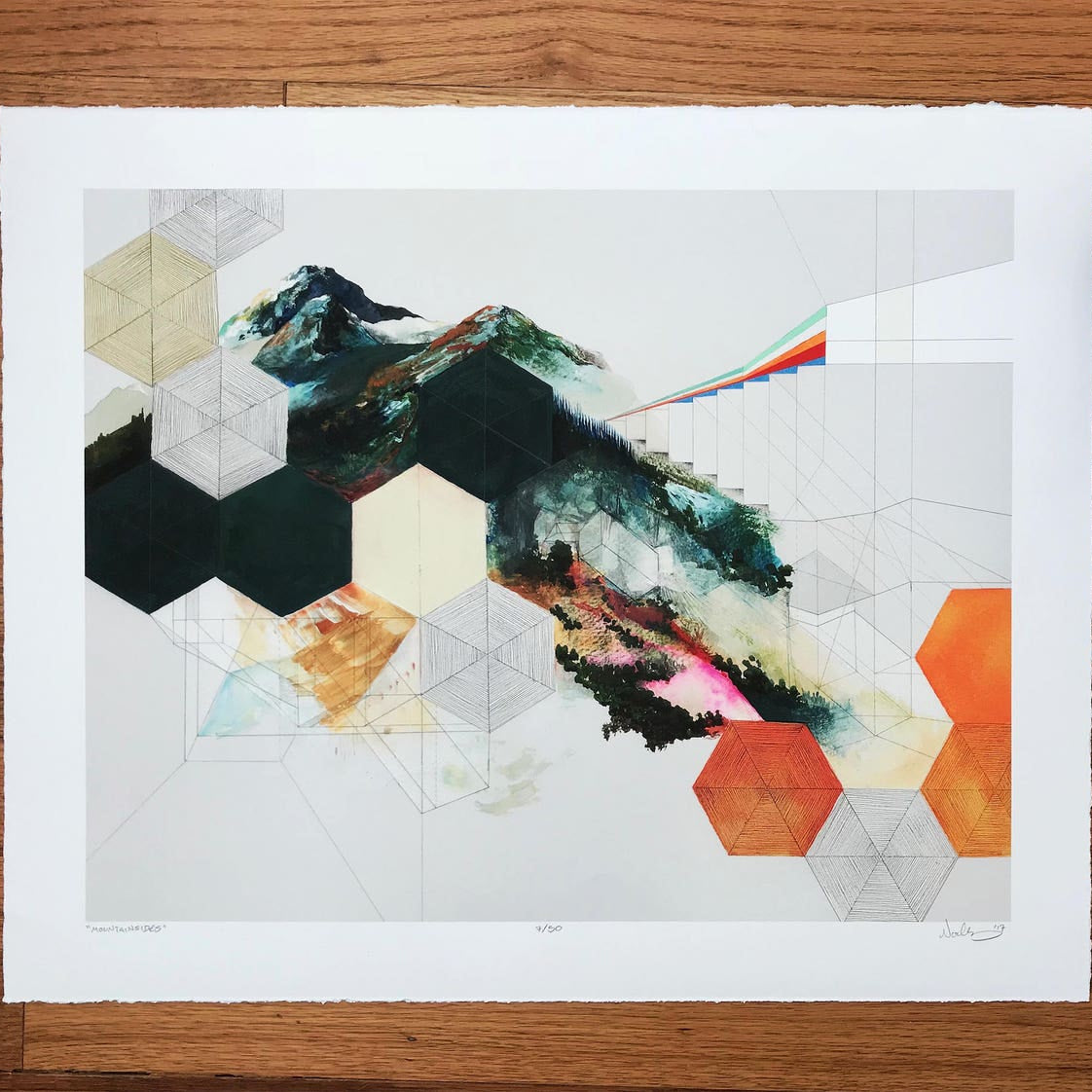 print shown against a wooden table. 