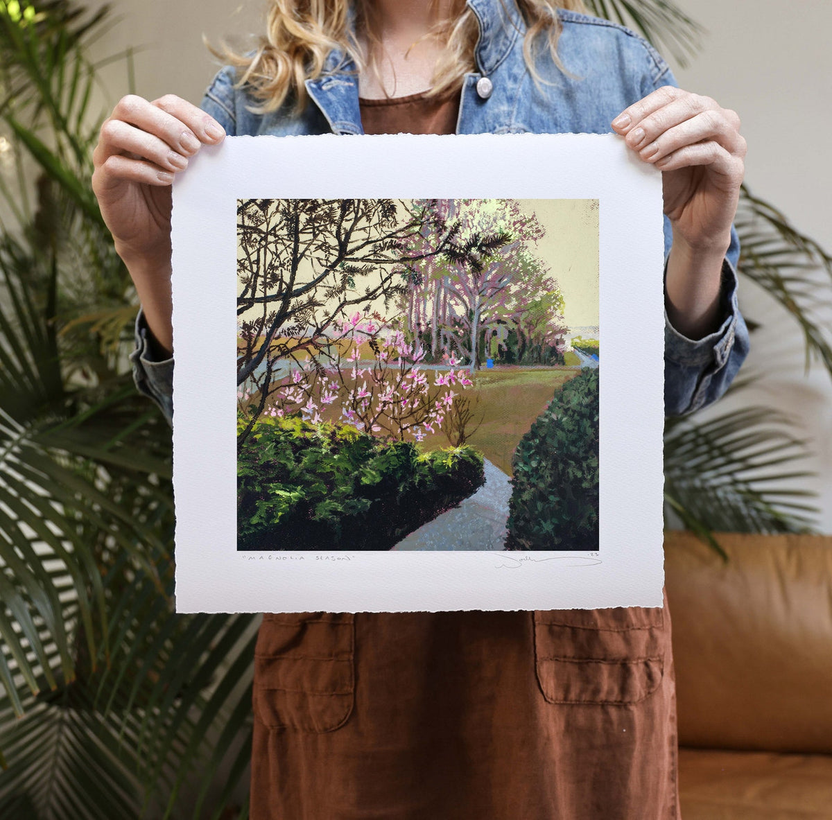 print half by a woman with plants in the background. 