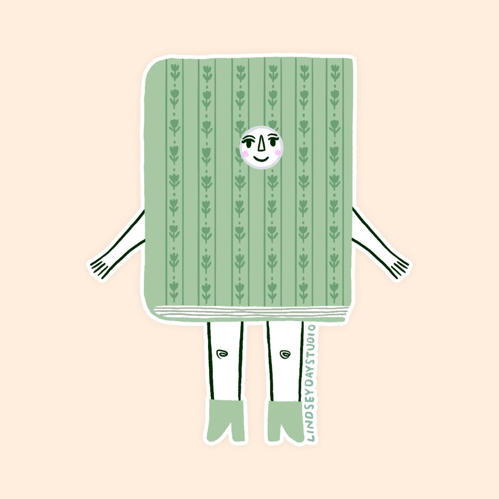 Simple green book with flower design. Has face arms and legs. 