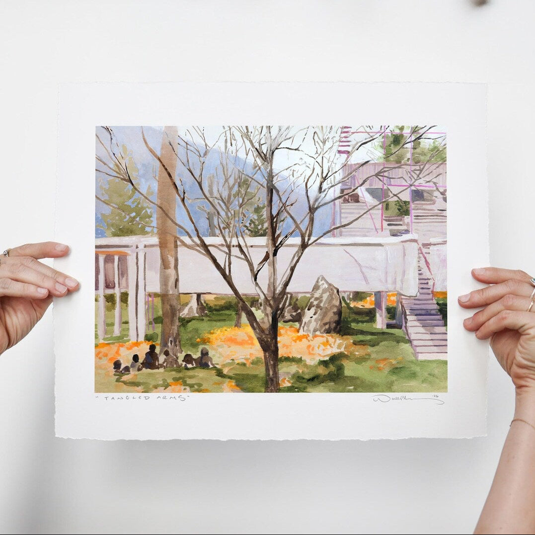 Barren tree stands amongst its fallen leaves, casting shadows on small human forms and modern architecture. 