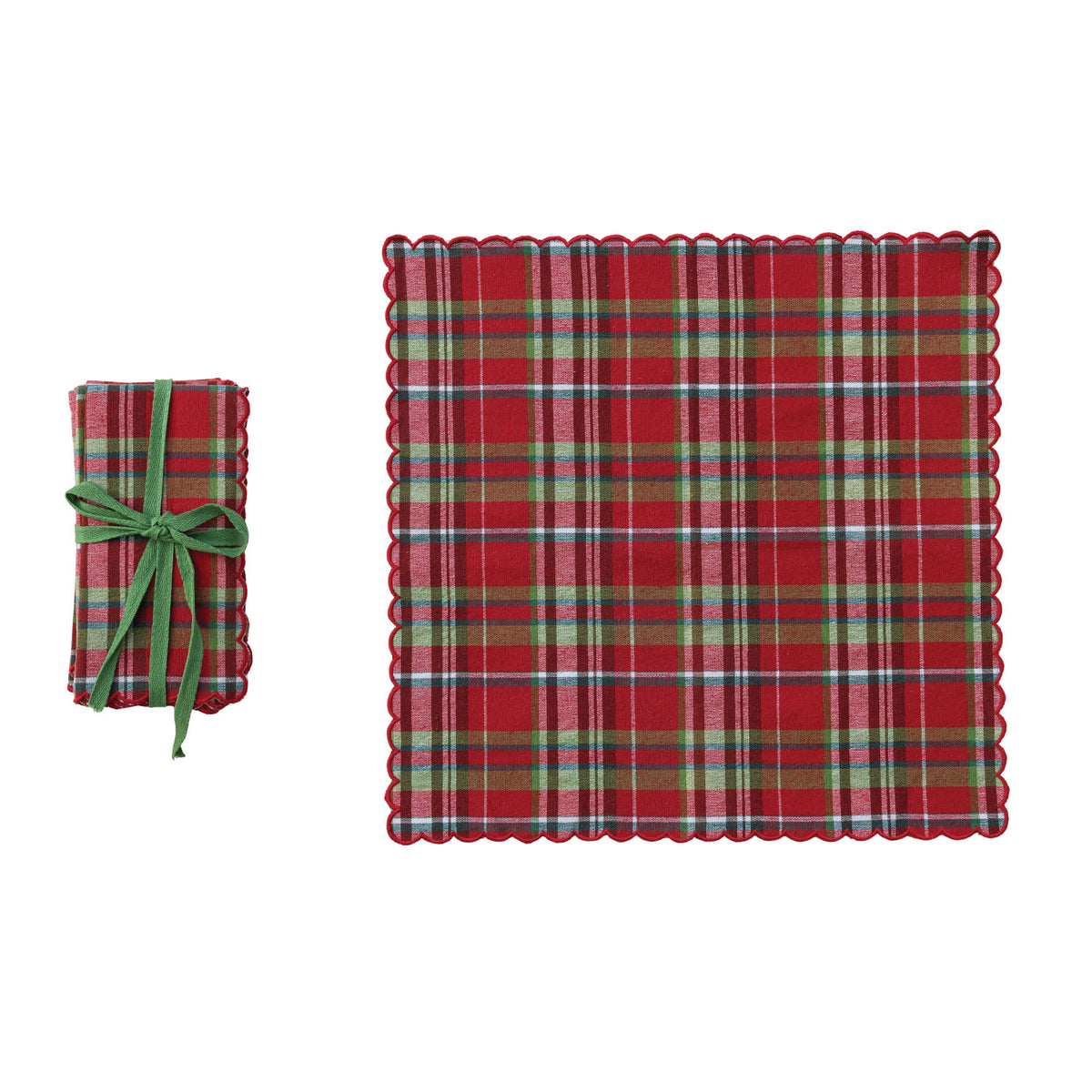 Scalloped Cotton Napkin Set - Classic Plaid. Bring a cozy, inviting charm to your dining table with our Scalloped Cotton Napkin Set in Classic Plaid. Crafted from soft woven cotton, this set of four features delightful scalloped edges with neat contrast stitching that adds a thoughtful, handcrafted feel to every meal. Perfectly tied together with a charming green cotton tape, they make a wonderfully thoughtful gift or a lovely, warm addition to your own family gatherings and holiday celebrations.